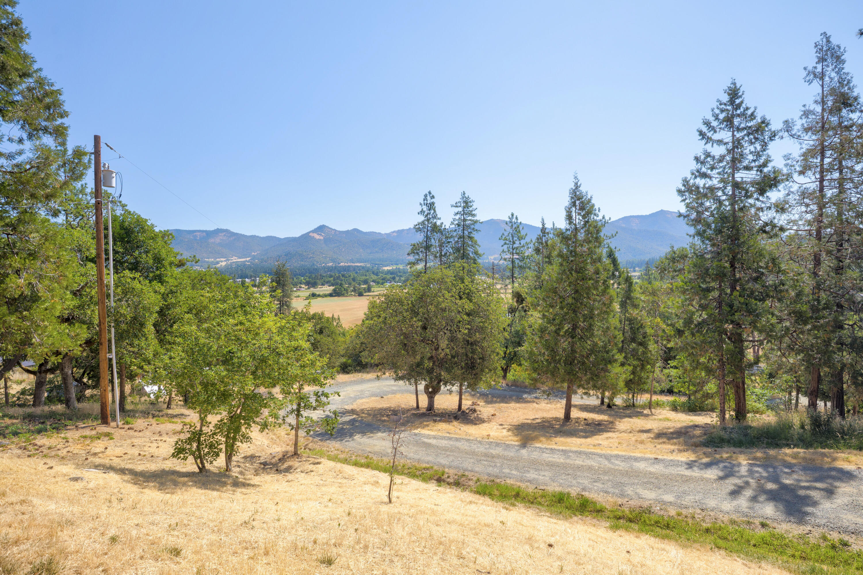 12748 Water Gap Road Williams, OR 97544 - Photo 28 of 35 a view of a yard with a house in the background