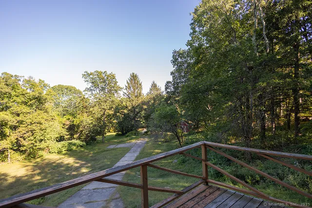 a view of balcony with yard