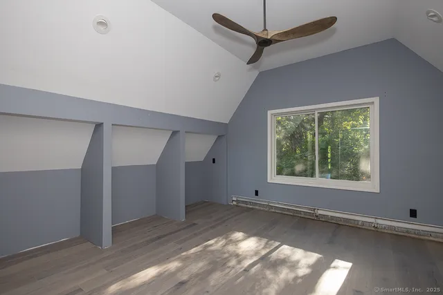 a view of an empty room with a window