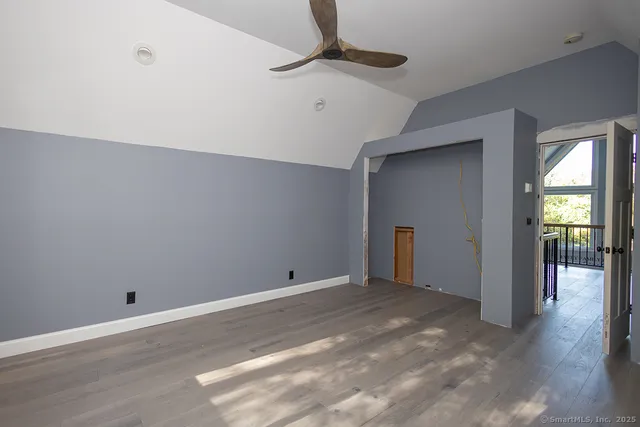 a view of an empty room with glass door