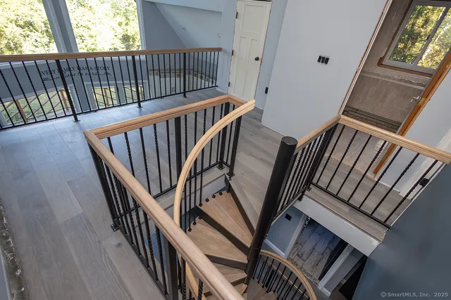 a view of stairs with wooden floor