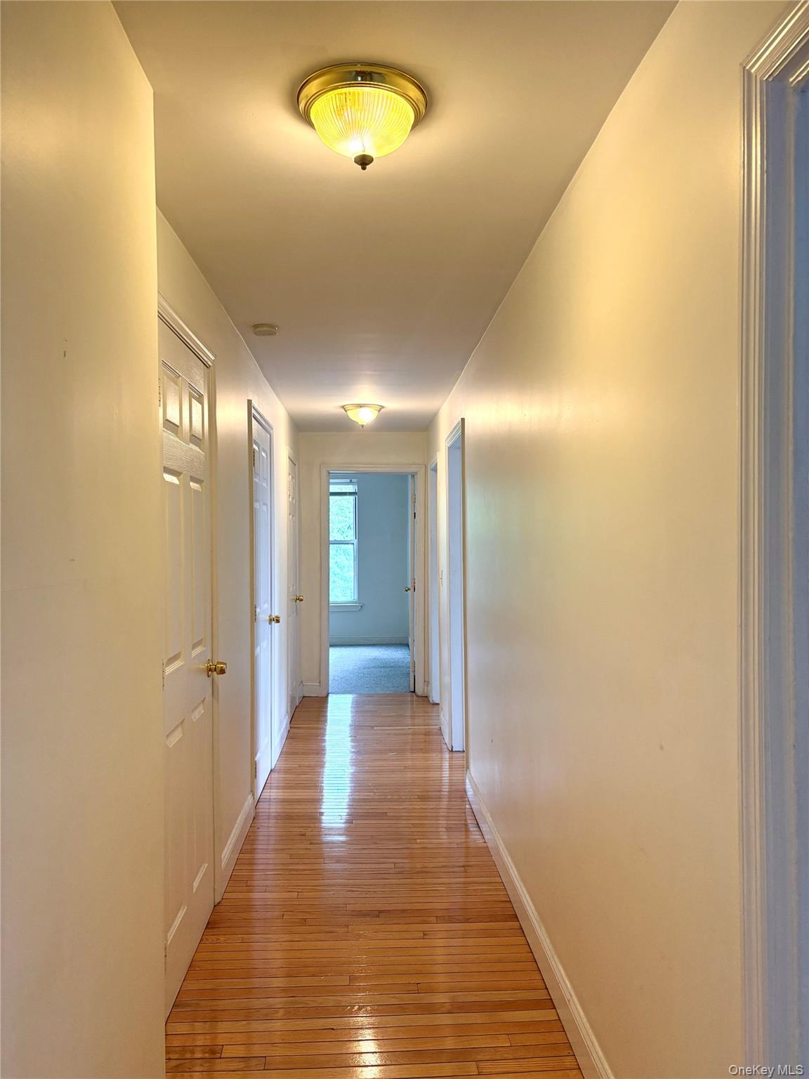 2 Morris Avenue, Unit 203 Cold Spring, NY 10516 - Photo 2 of 32 a view of a hallway with wooden floor