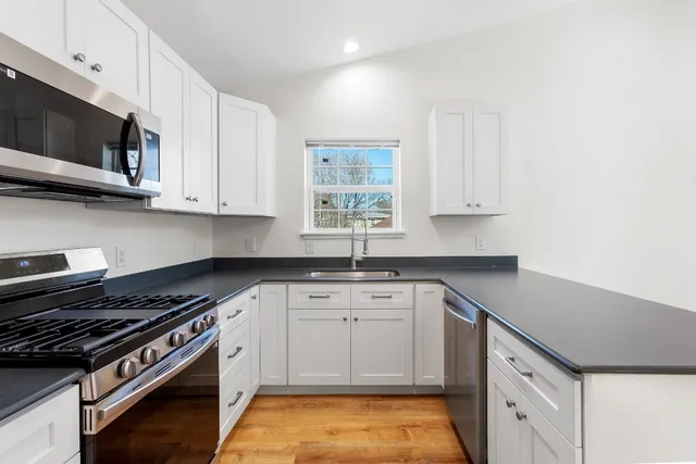 a view of kitchen with furniture and window