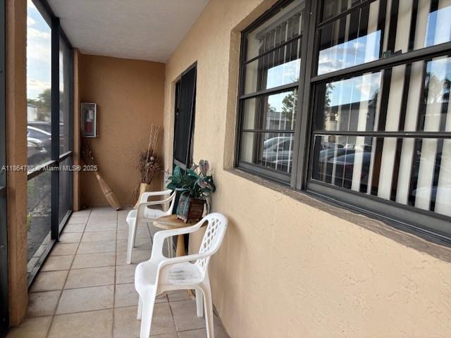 18280 Mediterranean Boulevard, Unit 23 Hialeah, FL 33015 - Photo 2 of 2 a view of a dining room with furniture window and wooden floor