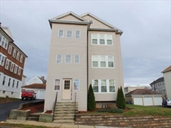 a front view of a house with stairs