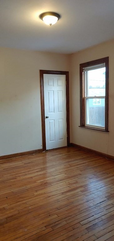 20 Wabash Avenue Worcester, MA 01604 - Photo 14 of 26 an empty room with wooden floor and windows
