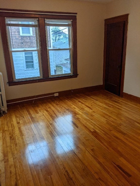 20 Wabash Avenue Worcester, MA 01604 - Photo 16 of 26 a view of an empty room with wooden floor and a window