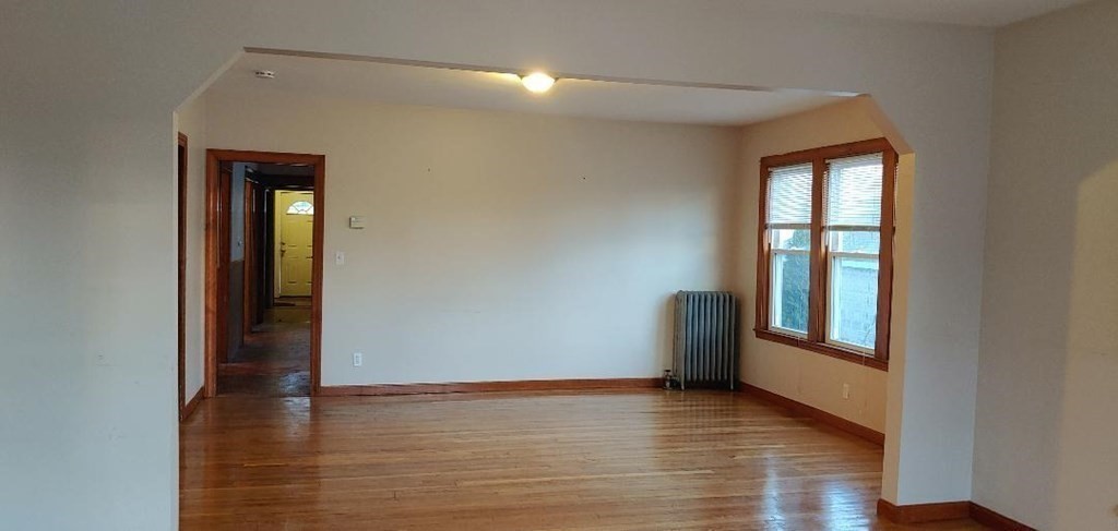 20 Wabash Avenue Worcester, MA 01604 - Photo 17 of 26 a view of an empty room with wooden floor and a window