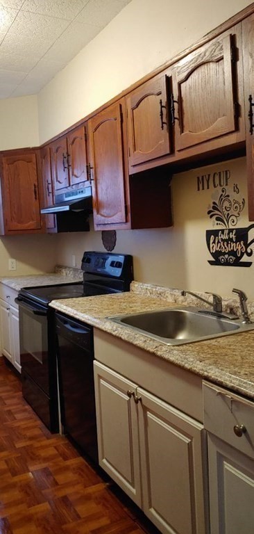 20 Wabash Avenue Worcester, MA 01604 - Photo 20 of 26 a kitchen with stainless steel appliances granite countertop a sink stove and cabinets