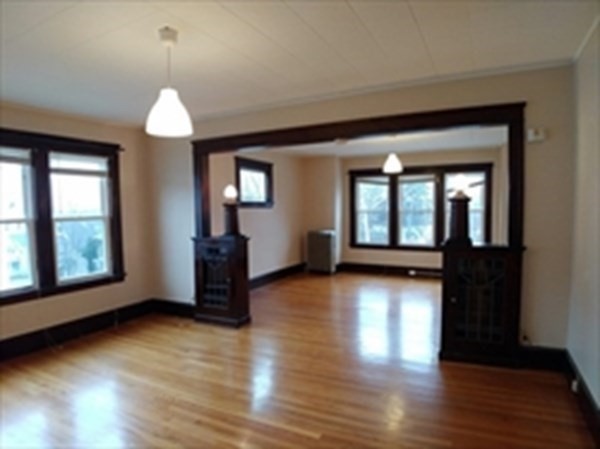 20 Wabash Avenue Worcester, MA 01604 - Photo 4 of 26 an empty room with wooden floor and windows
