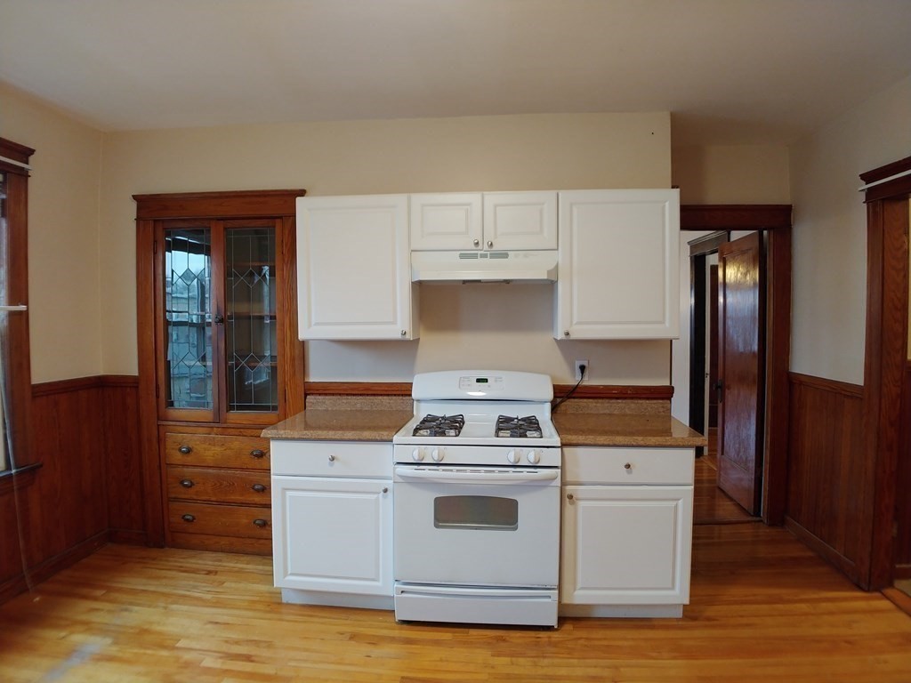 20 Wabash Avenue Worcester, MA 01604 - Photo 5 of 26 a kitchen with a stove and a refrigerator