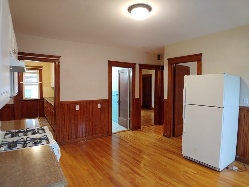 20 Wabash Avenue Worcester, MA 01604 - Photo 7 of 26 a view of a kitchen with a refrigerator and a stove