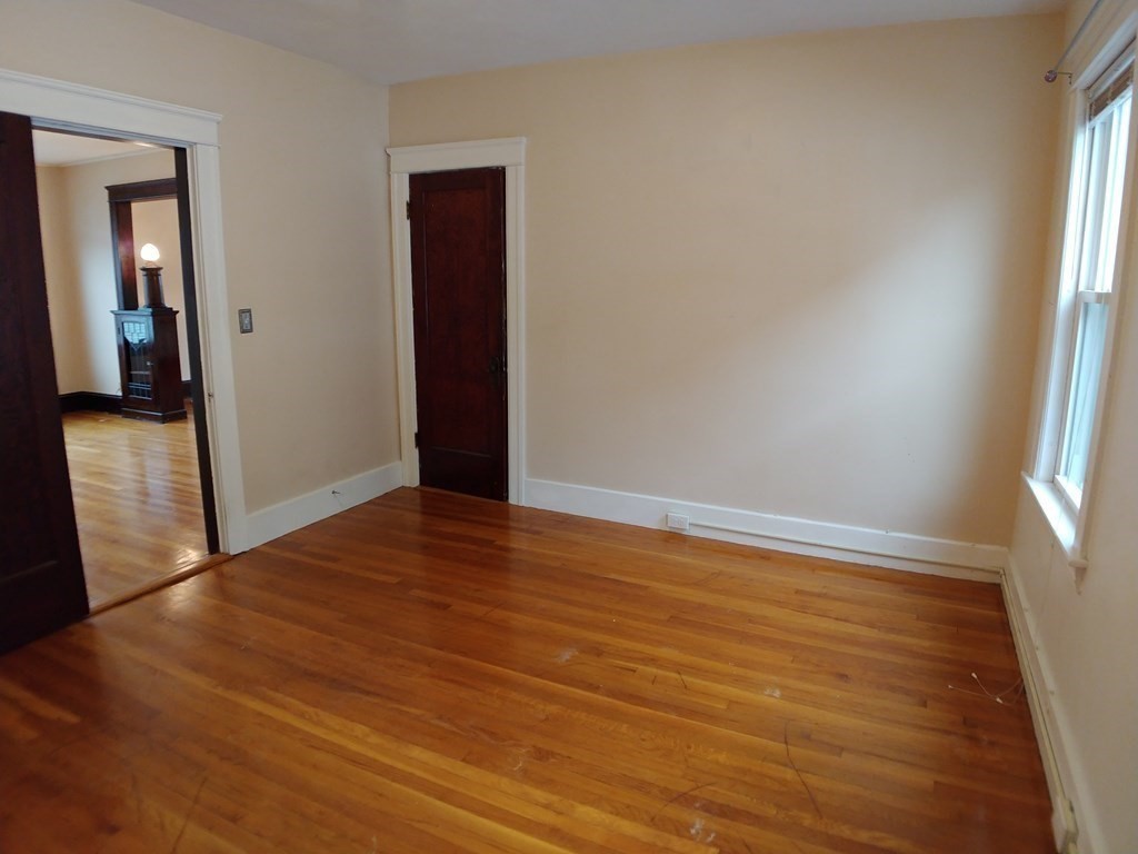 20 Wabash Avenue Worcester, MA 01604 - Photo 10 of 26 an empty room with wooden floor and windows