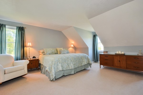 7 John Riley Road Ayer, MA 01432 - Photo 17 of 29 a spacious bedroom with a bed couch and windows