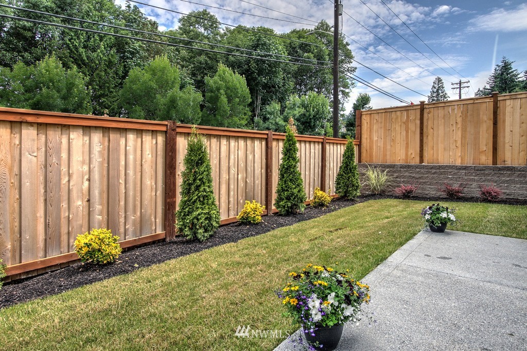 2405 196th Place Southeast, Unit 2 Bothell, WA 98012 - Photo 14 of 14 a view of a backyard with potted plants