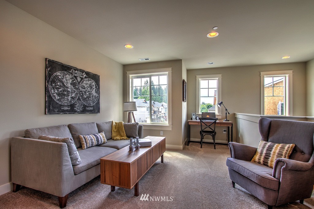 2405 196th Place Southeast, Unit 2 Bothell, WA 98012 - Photo 8 of 14 a living room with furniture and a large window