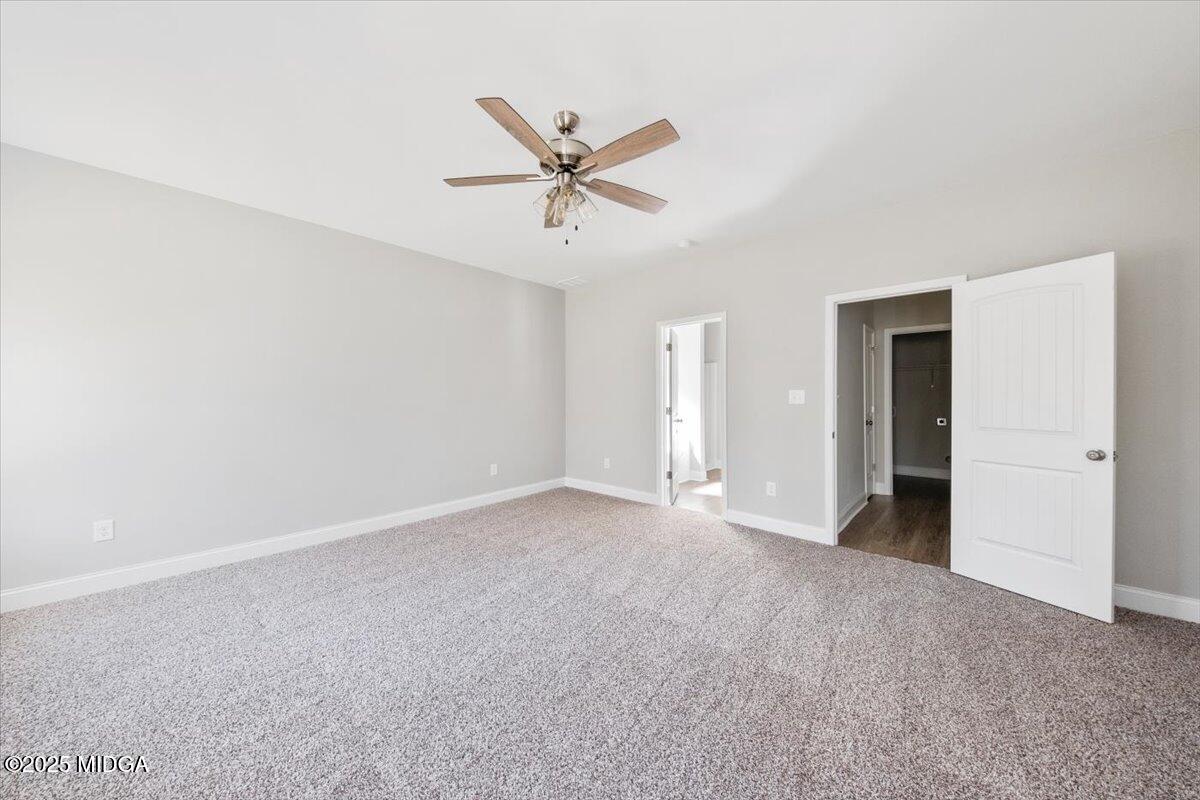 372 Walnut Grove Road Gray, GA 31032 - Photo 11 of 21 a view of a livingroom with a ceiling fan and window