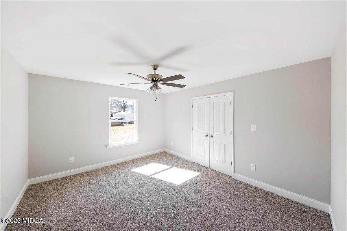 372 Walnut Grove Road Gray, GA 31032 - Photo 14 of 21 a view of empty room with window