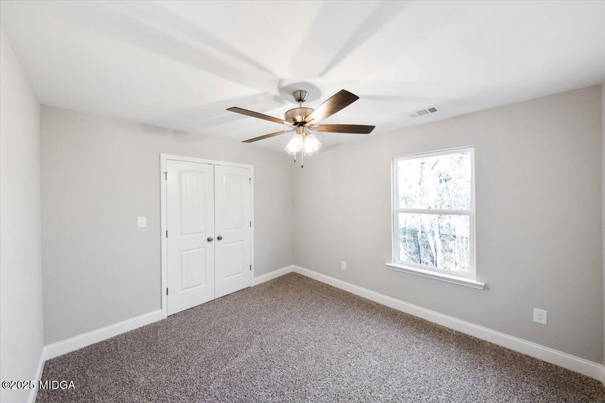 372 Walnut Grove Road Gray, GA 31032 - Photo 17 of 21 a view of an empty room with a window
