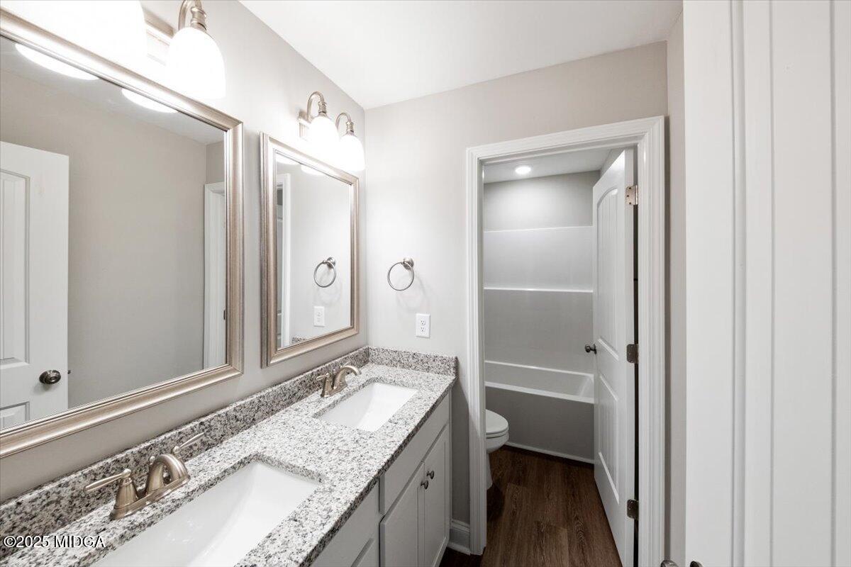 372 Walnut Grove Road Gray, GA 31032 - Photo 18 of 21 a bathroom with a granite countertop sink and a mirror