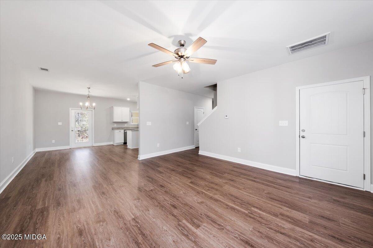372 Walnut Grove Road Gray, GA 31032 - Photo 3 of 21 a view of an empty room with wooden floor and a ceiling fan