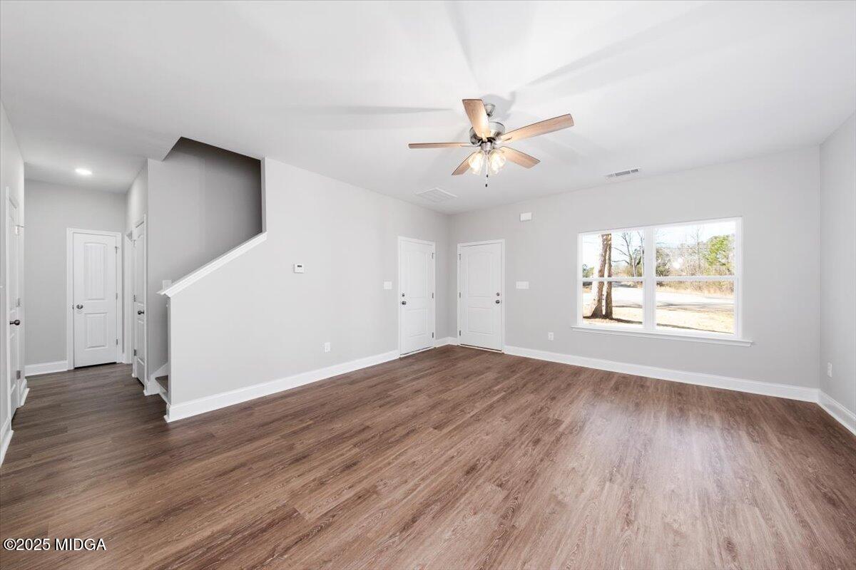 372 Walnut Grove Road Gray, GA 31032 - Photo 4 of 21 wooden floor in an empty room with a window
