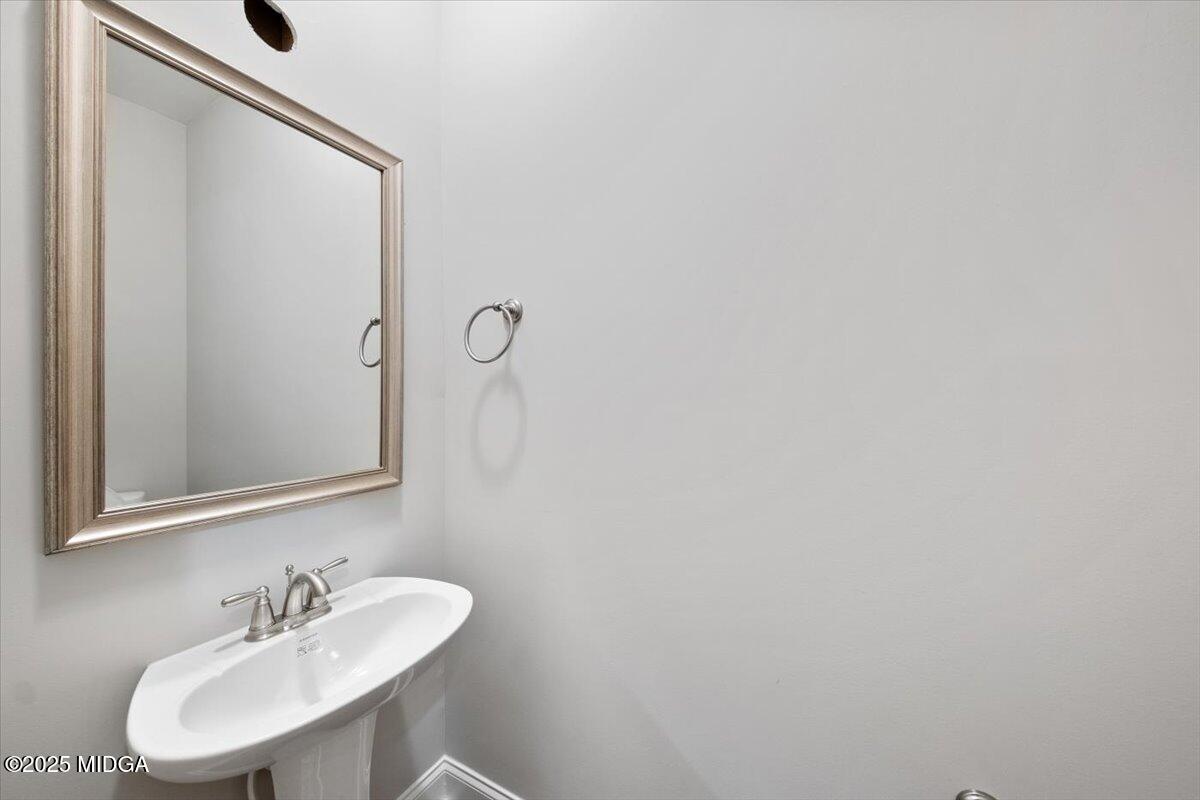 372 Walnut Grove Road Gray, GA 31032 - Photo 9 of 21 a bathroom with a sink and a mirror