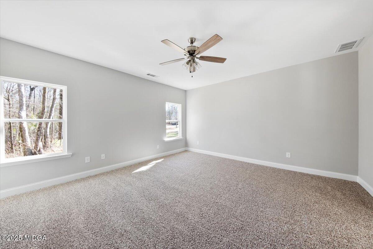 372 Walnut Grove Road Gray, GA 31032 - Photo 10 of 21 a view of an empty room with a window