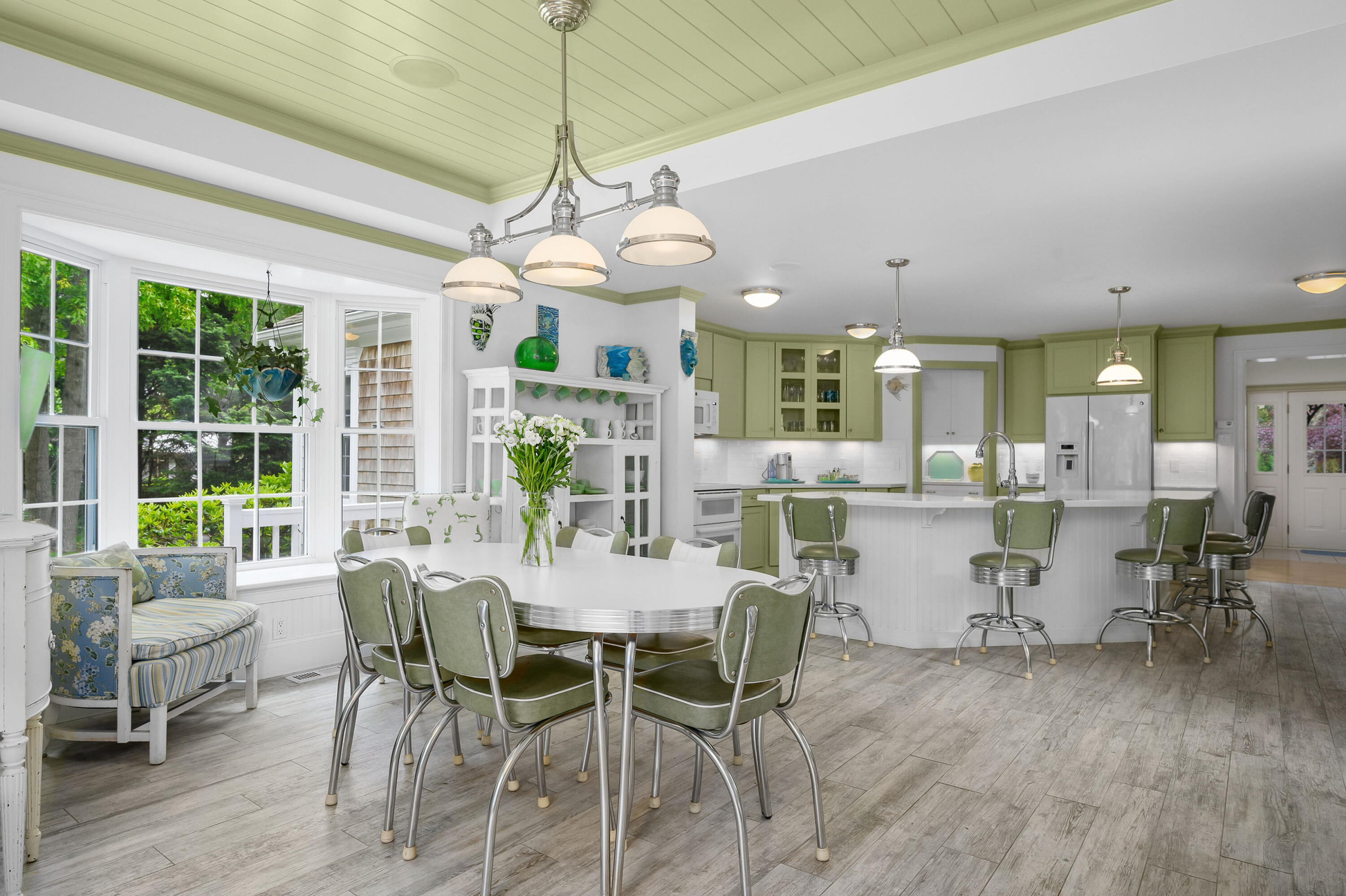 256 Pleasant Bay Road Harwich, MA 02645 - Photo 12 of 71 a view of a dining room with furniture window and outside view