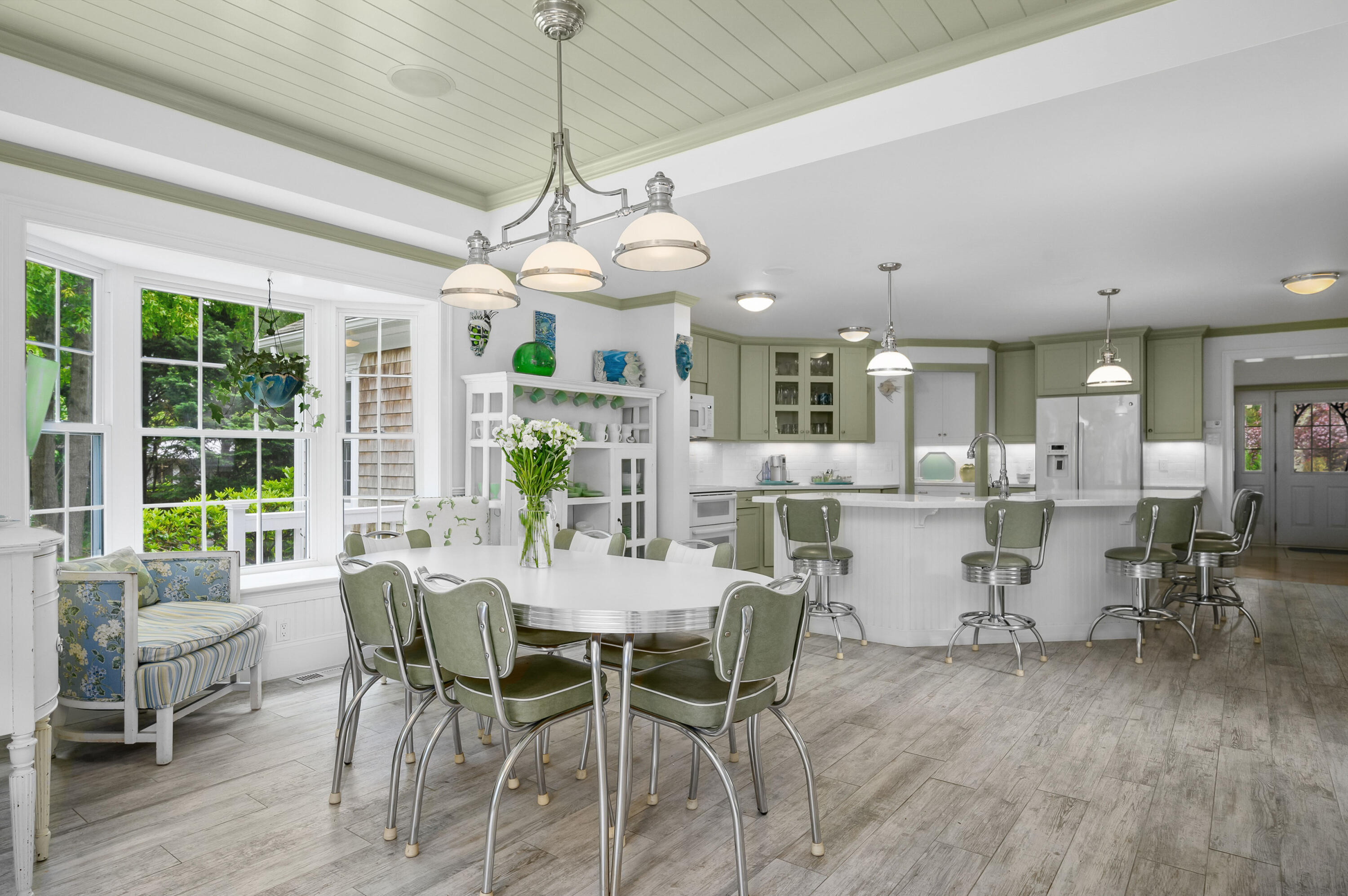 256 Pleasant Bay Road Harwich, MA 02645 - Photo 13 of 71 a view of a dining room with furniture window and outside view