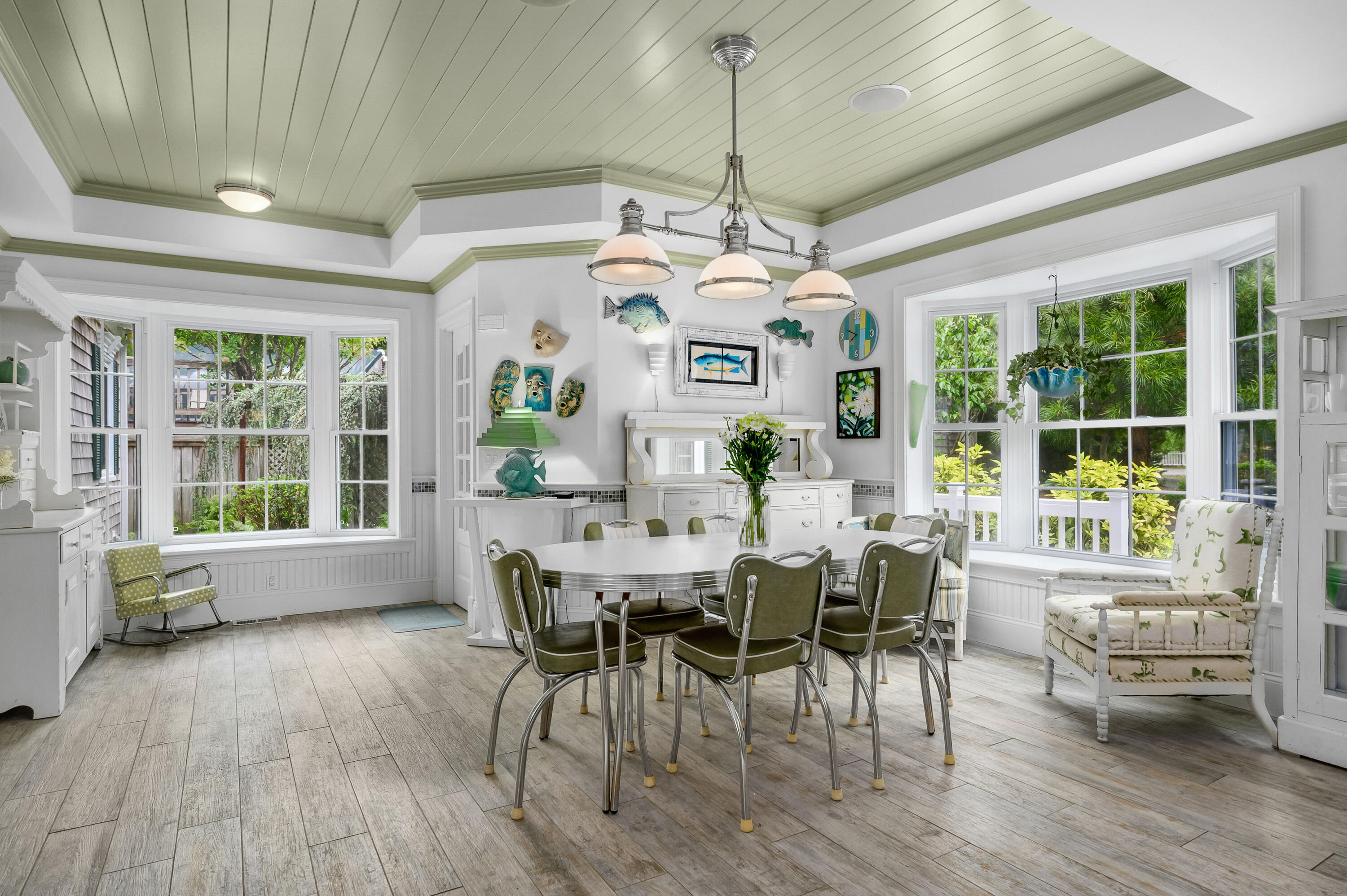256 Pleasant Bay Road Harwich, MA 02645 - Photo 14 of 71 a view of a dining room with furniture window and wooden floor