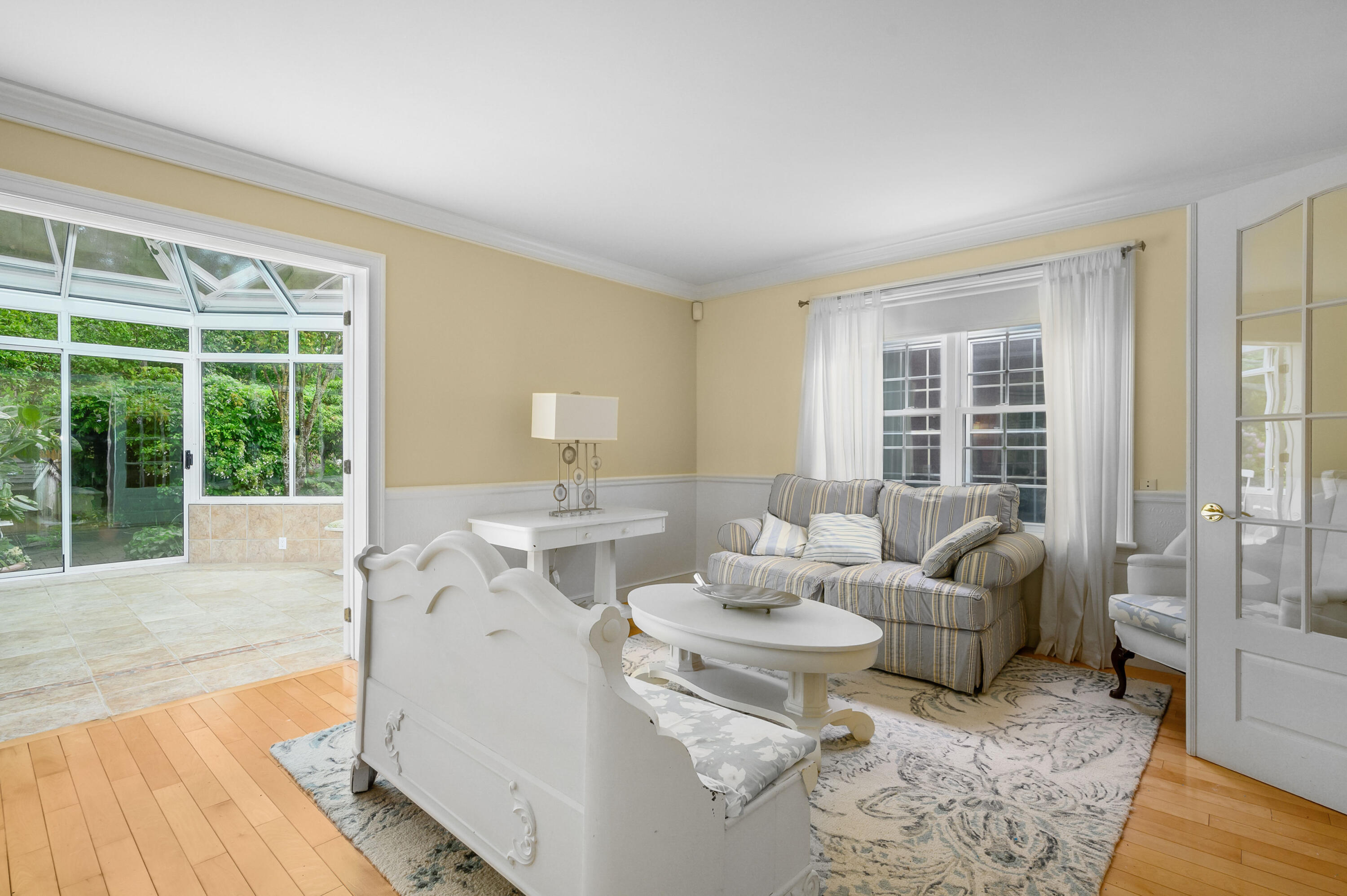 256 Pleasant Bay Road Harwich, MA 02645 - Photo 24 of 71 a living room with furniture and large windows