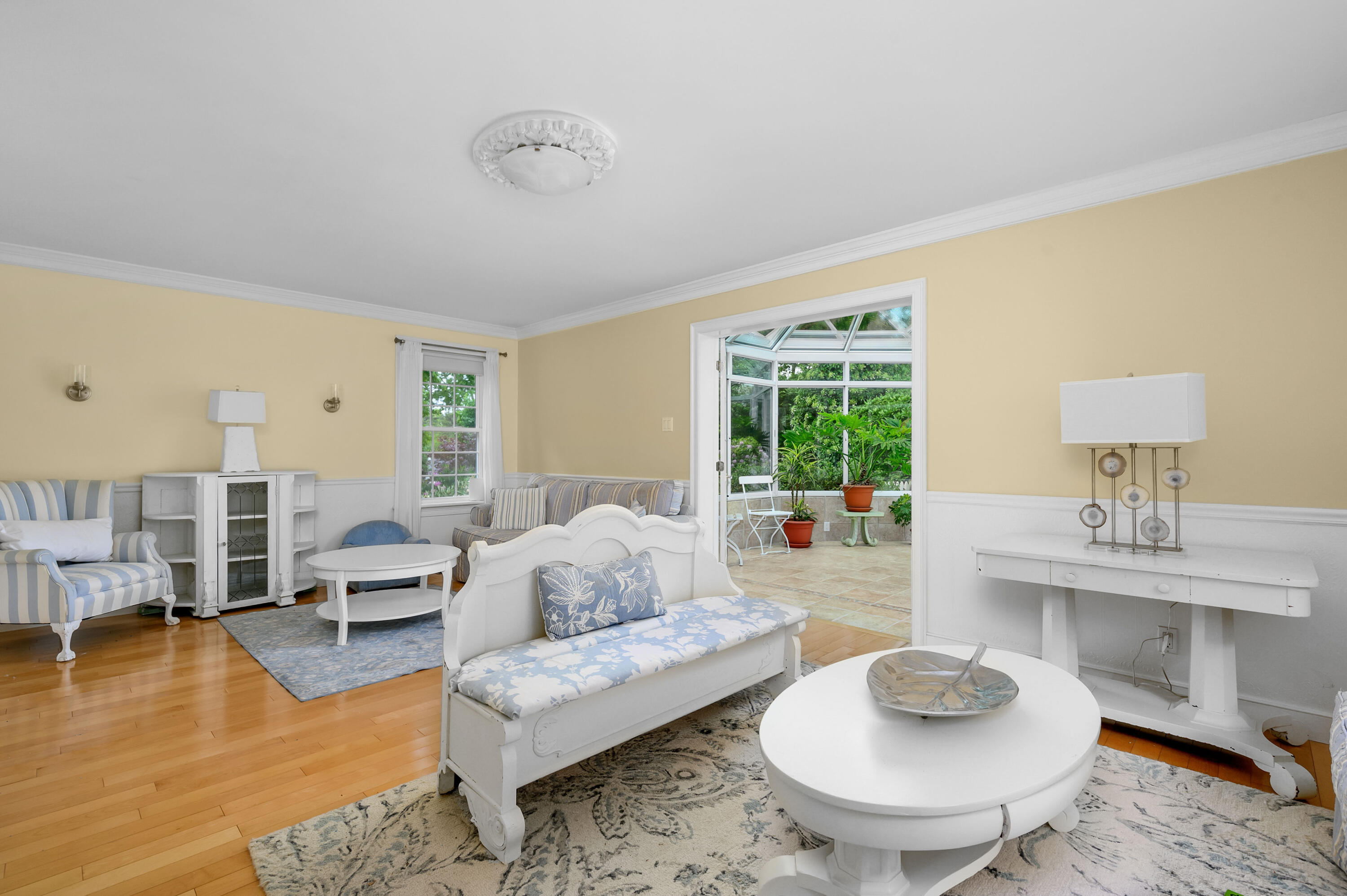 256 Pleasant Bay Road Harwich, MA 02645 - Photo 26 of 71 a living room with furniture and a wooden floor