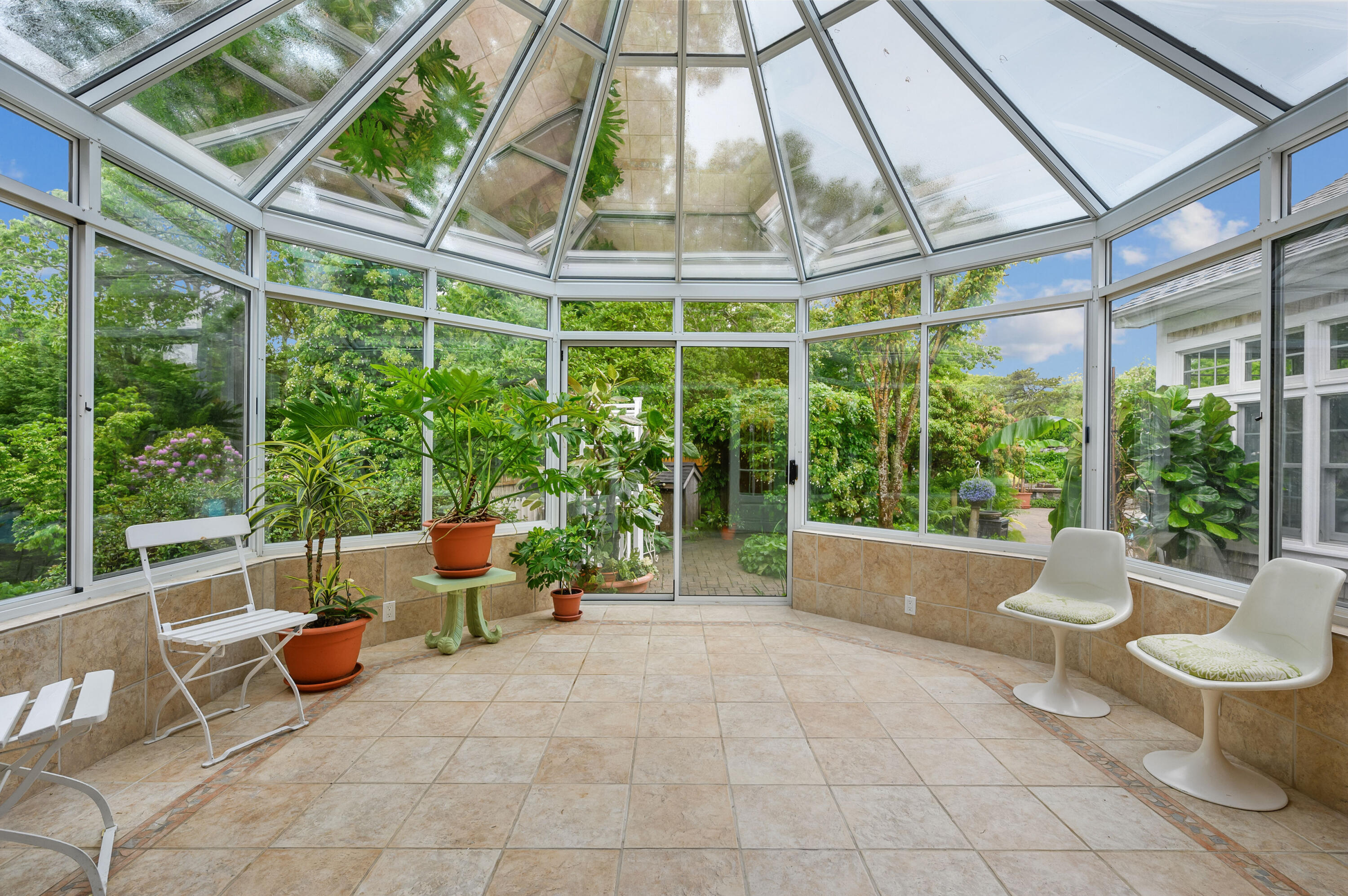 256 Pleasant Bay Road Harwich, MA 02645 - Photo 27 of 71 a building outdoor space with patio furniture and potted plants