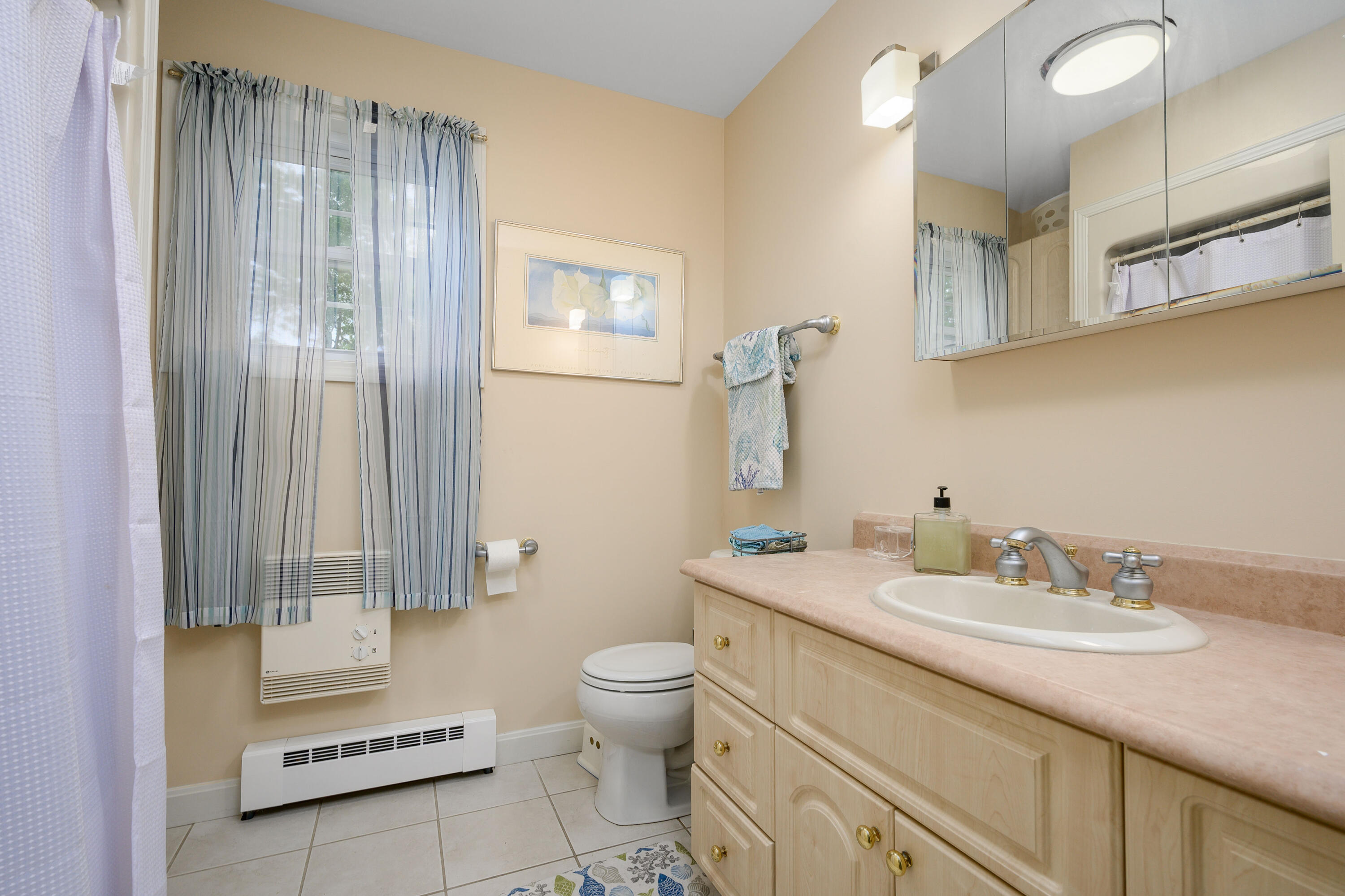 256 Pleasant Bay Road Harwich, MA 02645 - Photo 35 of 71 a bathroom with a granite countertop sink toilet and shower