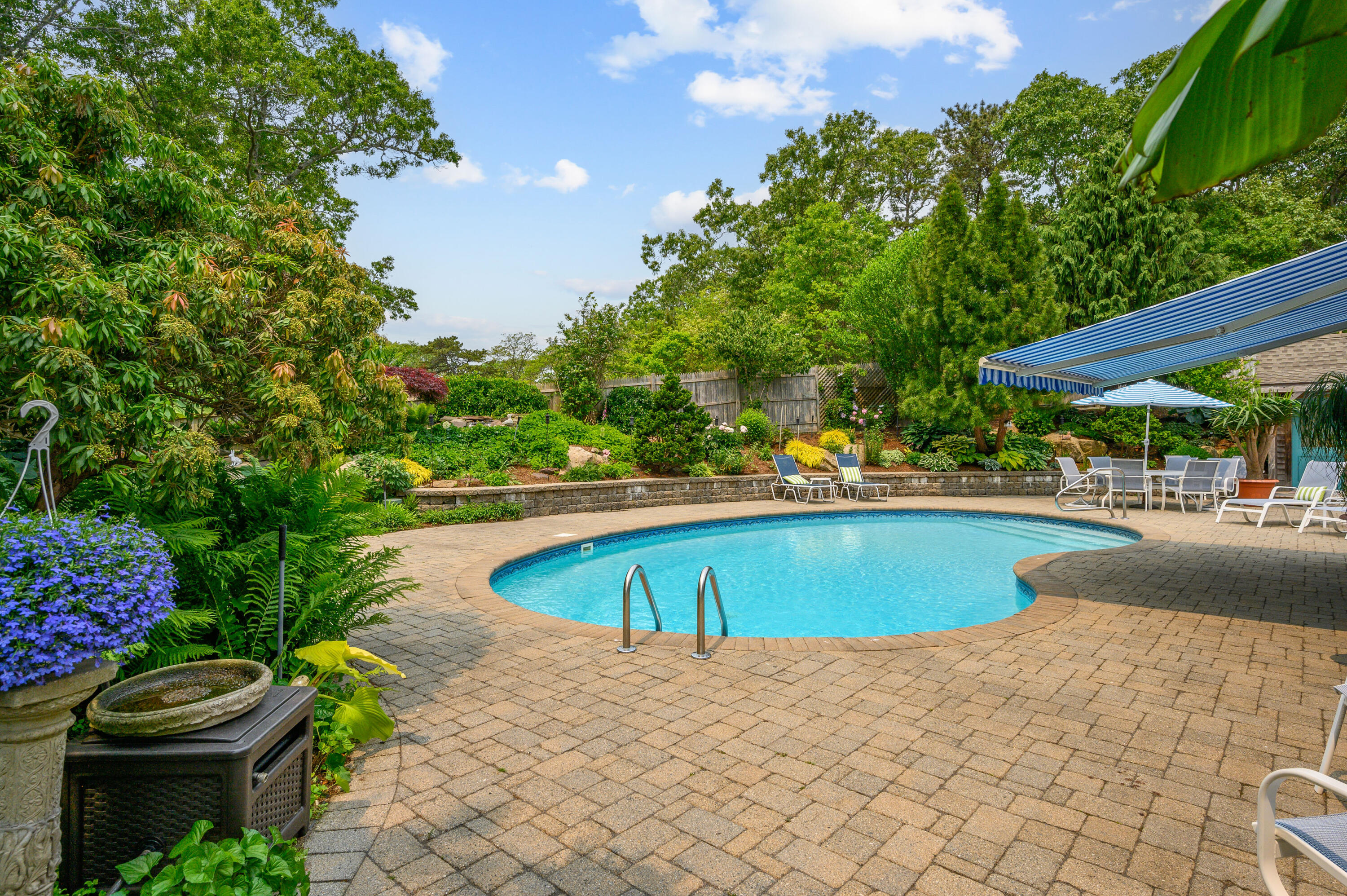 256 Pleasant Bay Road Harwich, MA 02645 - Photo 41 of 71 a view of swimming pool with outdoor seating and plants