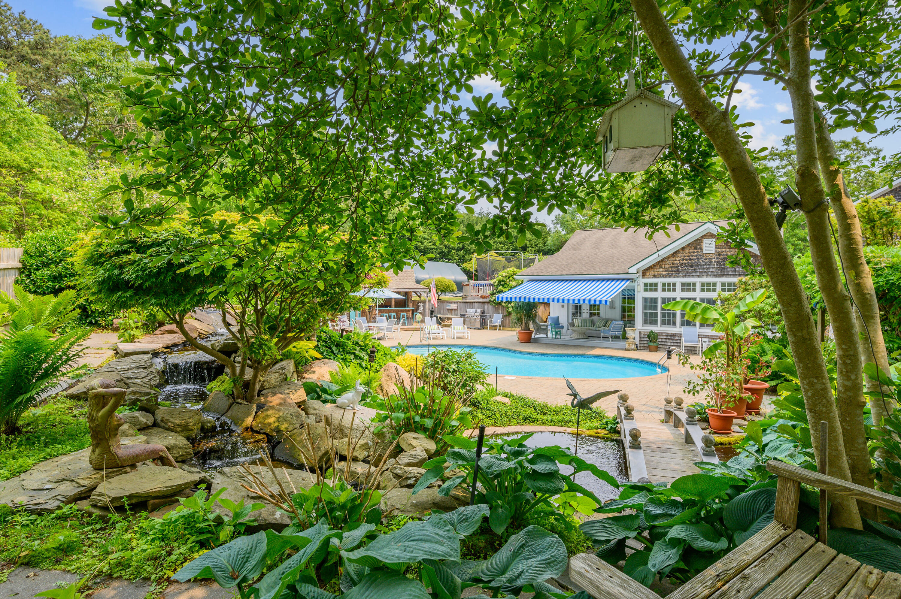 256 Pleasant Bay Road Harwich, MA 02645 - Photo 5 of 71 a aerial view of a house with swimming pool garden and patio