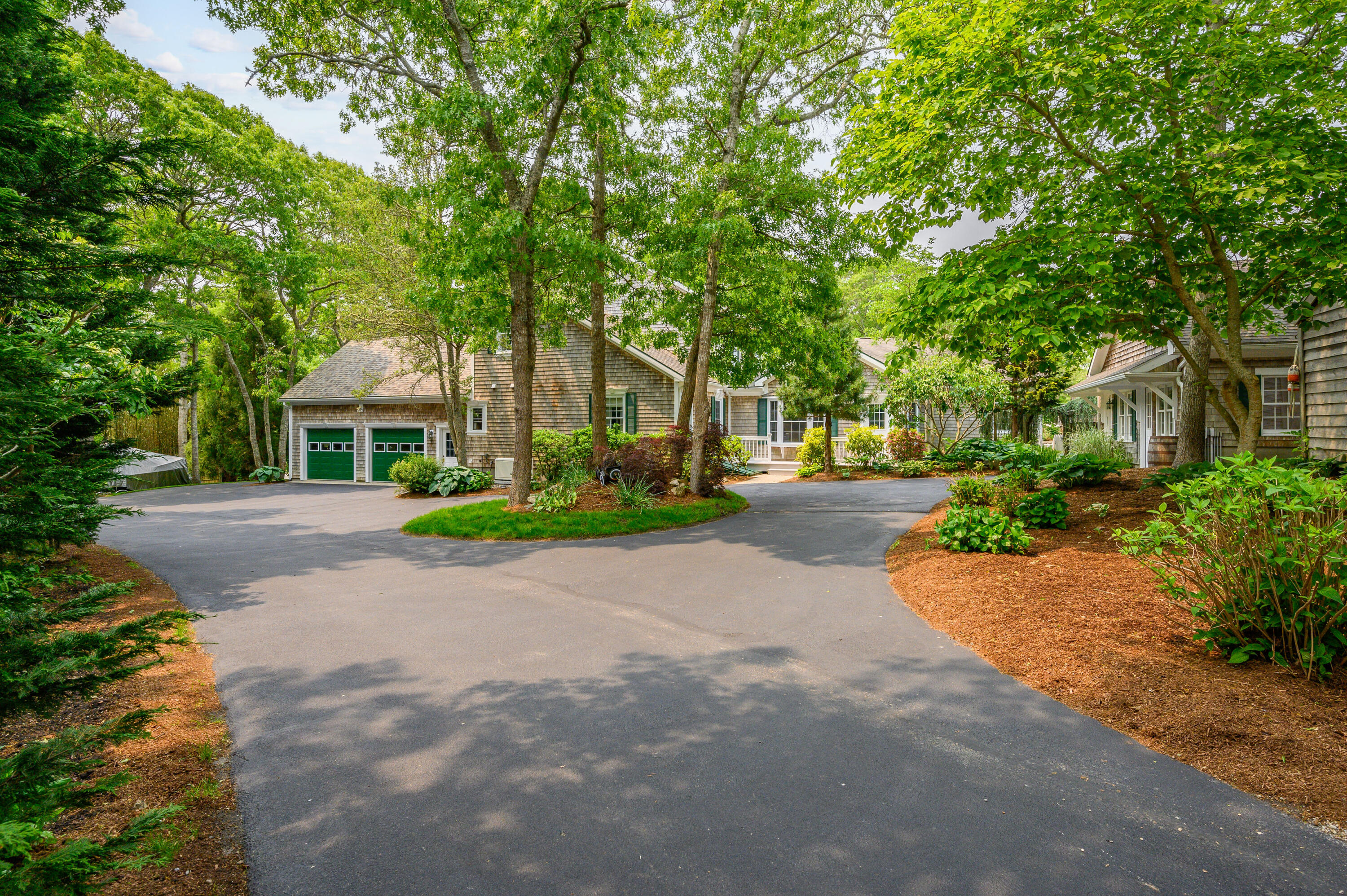 256 Pleasant Bay Road Harwich, MA 02645 - Photo 54 of 71 a front view of a house with yard and green space