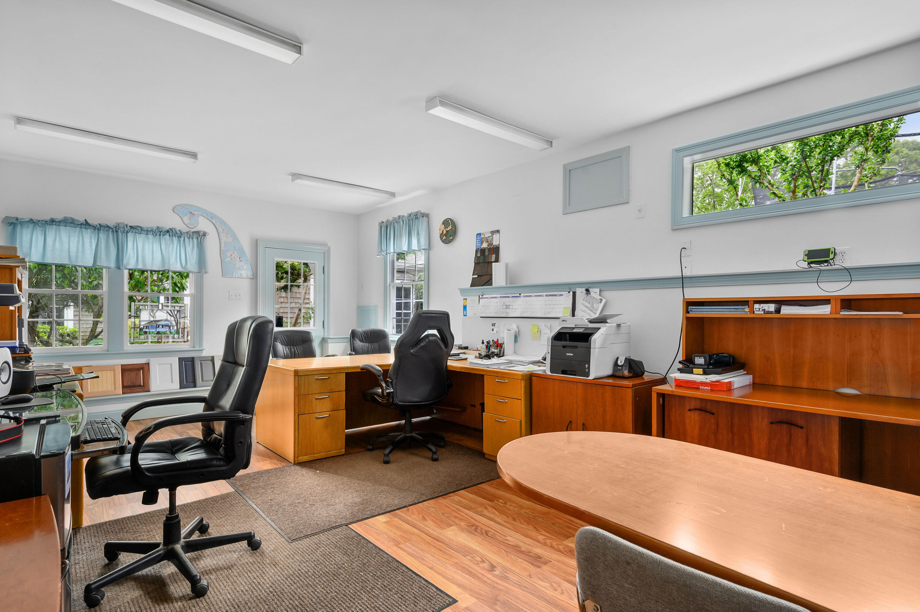 256 Pleasant Bay Road Harwich, MA 02645 - Photo 56 of 71 a work room with furniture a large window and wooden floor