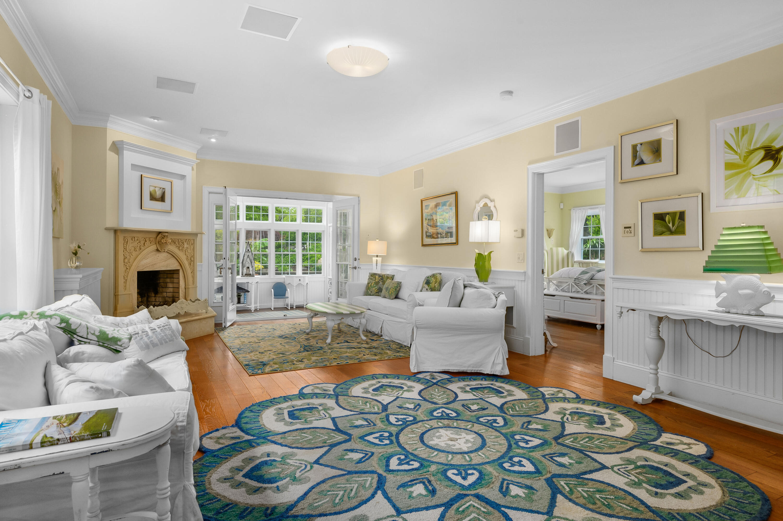 256 Pleasant Bay Road Harwich, MA 02645 - Photo 6 of 71 a living room with furniture and a fireplace