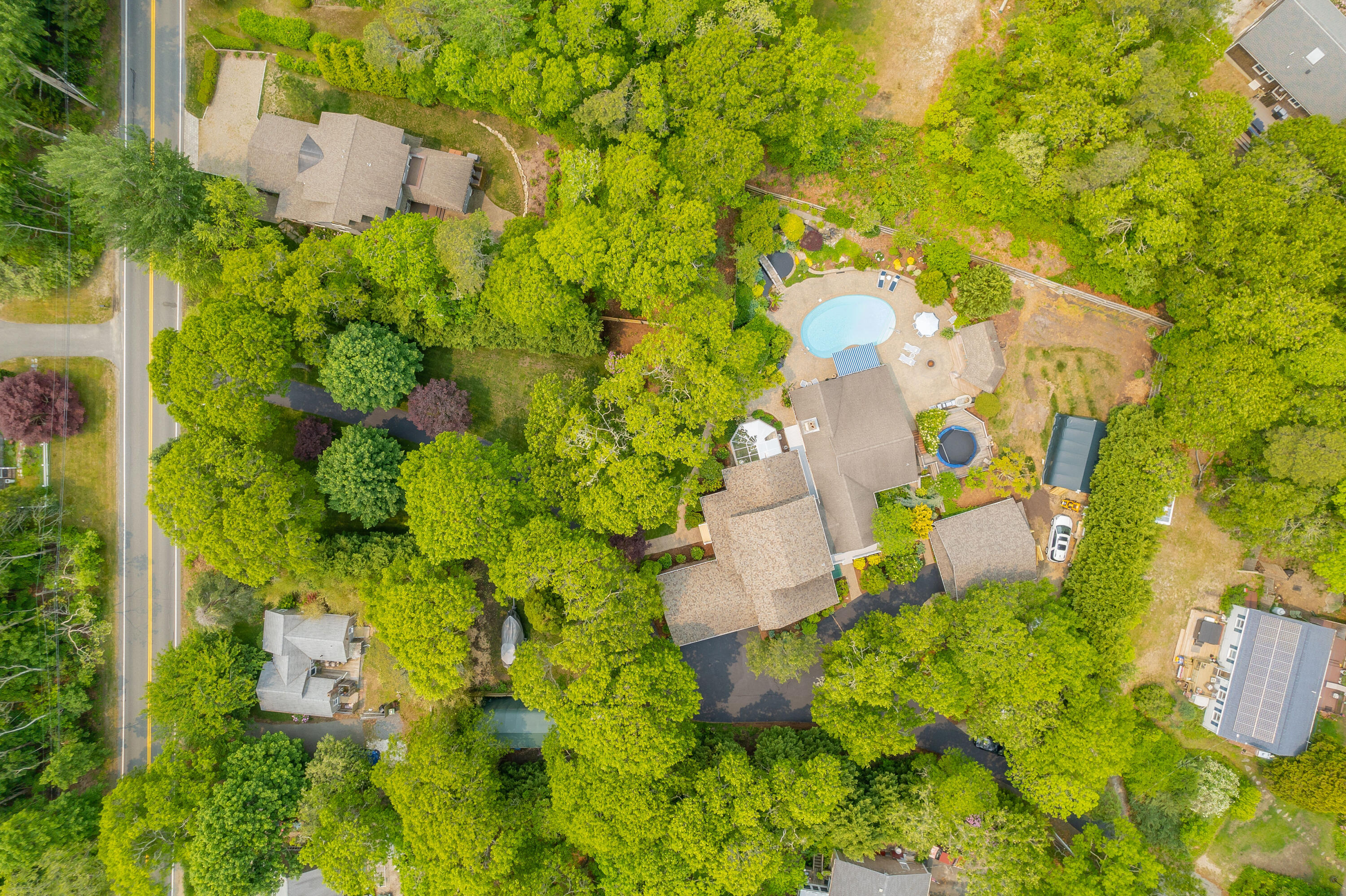256 Pleasant Bay Road Harwich, MA 02645 - Photo 64 of 71 an aerial view of residential house with swimming pool and lawn chairs