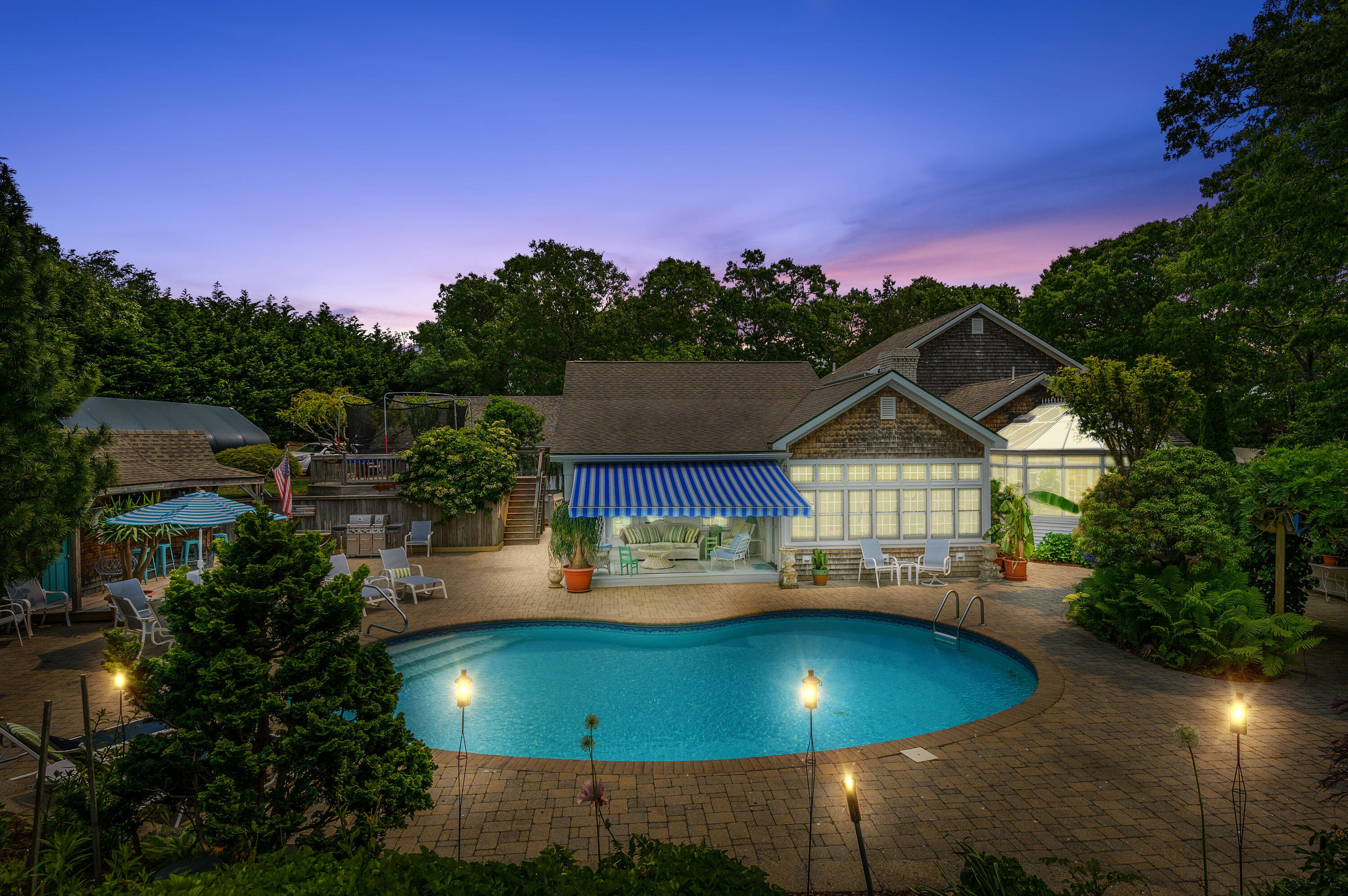 256 Pleasant Bay Road Harwich, MA 02645 - Photo 68 of 71 a view of a house with pool and trees in the background