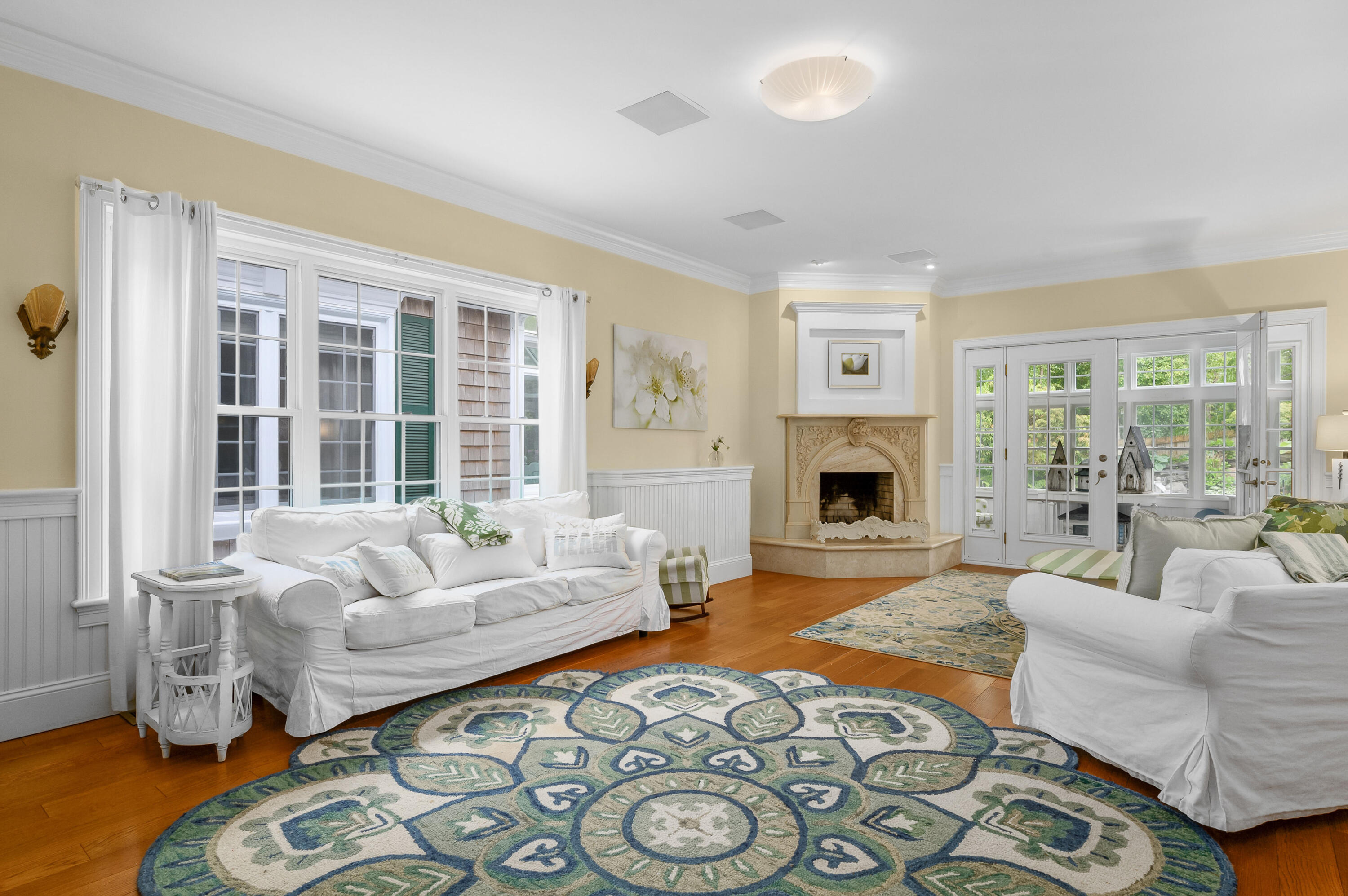 256 Pleasant Bay Road Harwich, MA 02645 - Photo 7 of 71 a living room with furniture and a fireplace