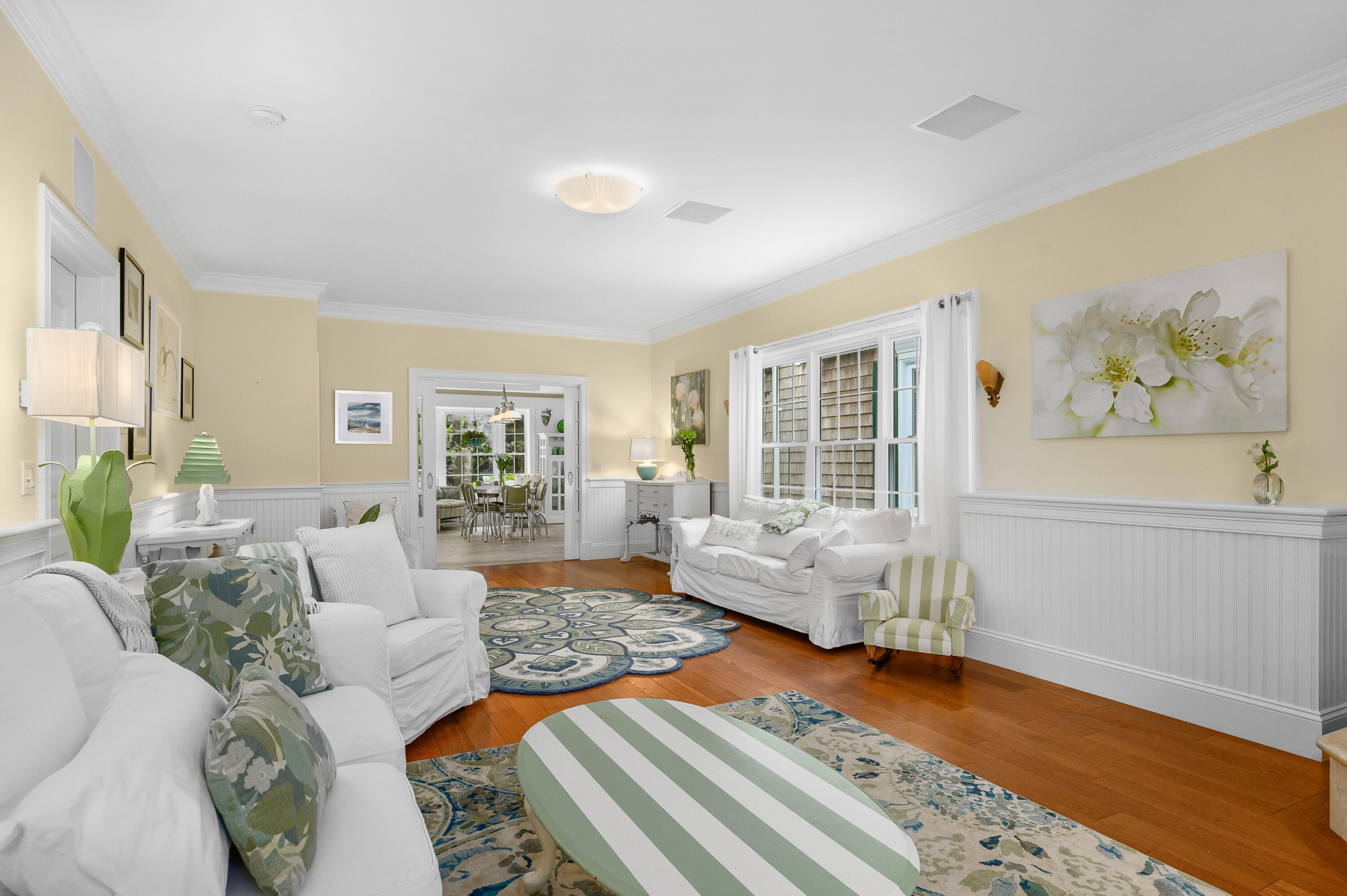 256 Pleasant Bay Road Harwich, MA 02645 - Photo 8 of 71 a living room with furniture and wooden floor