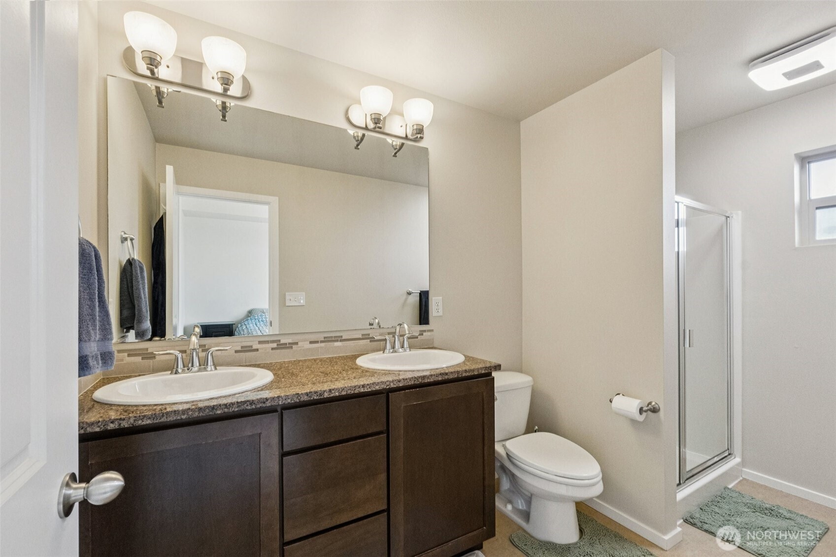 16408 2nd Avenue Southeast Bothell, WA 98012 - Photo 13 of 27 a bathroom with a granite countertop toilet sink and mirror