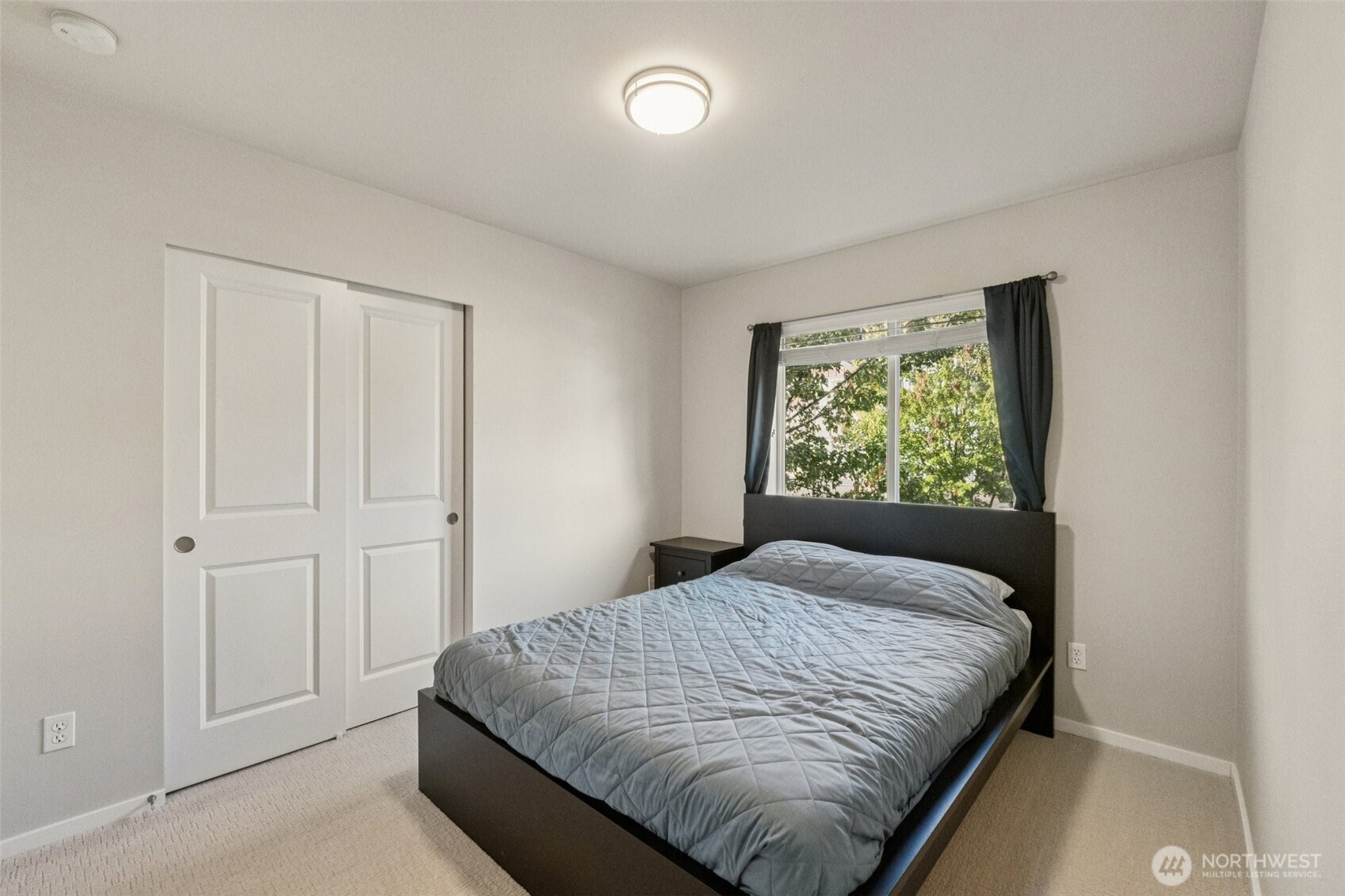 16408 2nd Avenue Southeast Bothell, WA 98012 - Photo 18 of 27 a bedroom with a bed and window