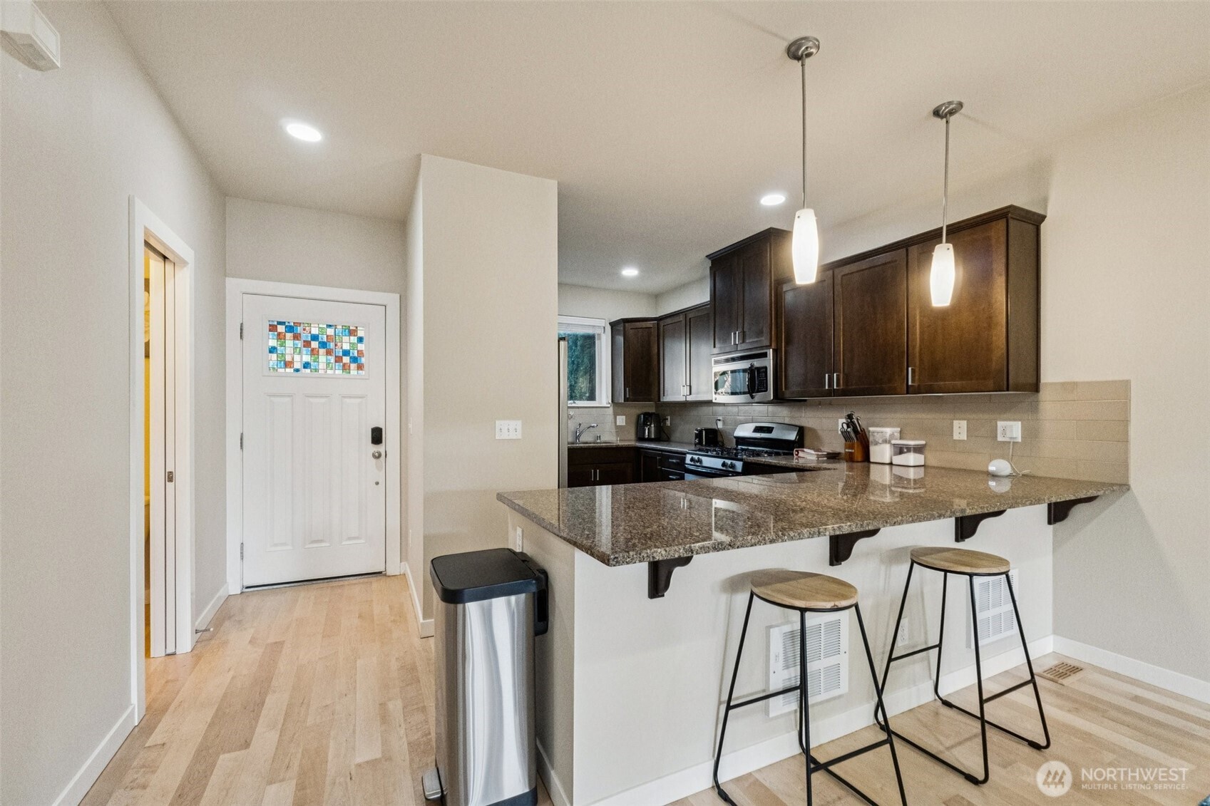 16408 2nd Avenue Southeast Bothell, WA 98012 - Photo 5 of 27 a kitchen with sink refrigerator and microwave