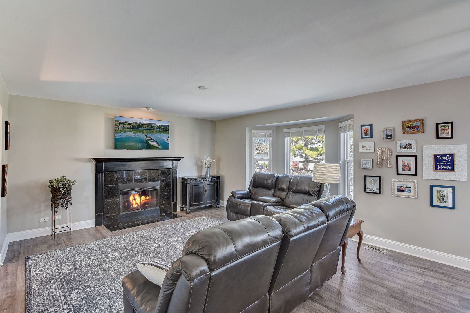 24860 Ambrose Road Plainfield, IL 60585 - Photo 7 of 50 a living room with furniture and a fireplace