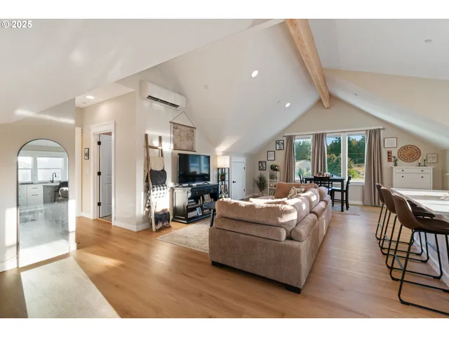 a living room with fireplace furniture and a table