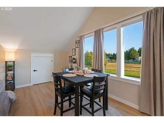 a dining room with furniture and window